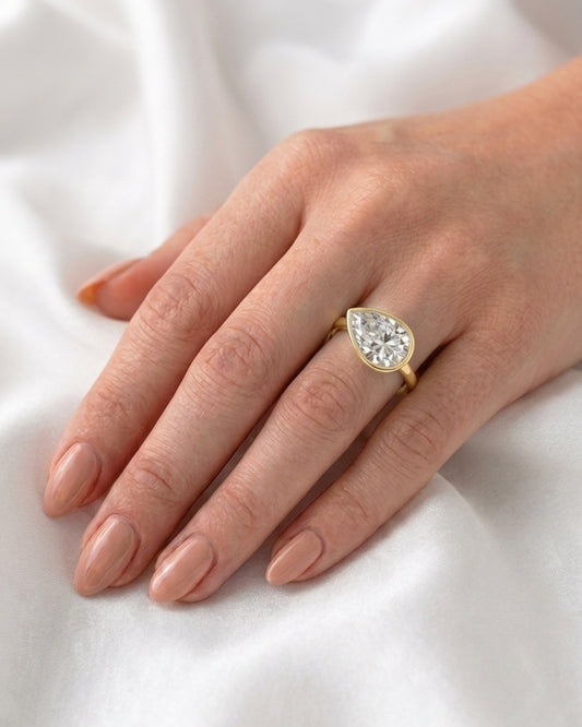 Charlie: East West Bezel Pear Solitaire Moissanite Engagement Ring