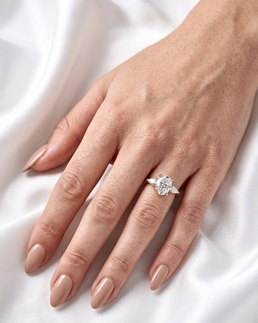 Indigo: Oval Pear Accent Stones Moissanite Engagement Ring