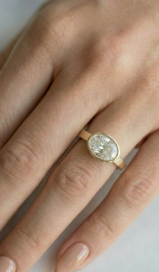 East West Bezel Oval Solitaire Diamond Engagement Ring