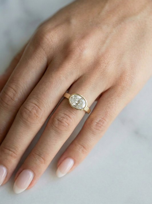 East West Bezel Oval Solitaire Diamond Engagement Ring
