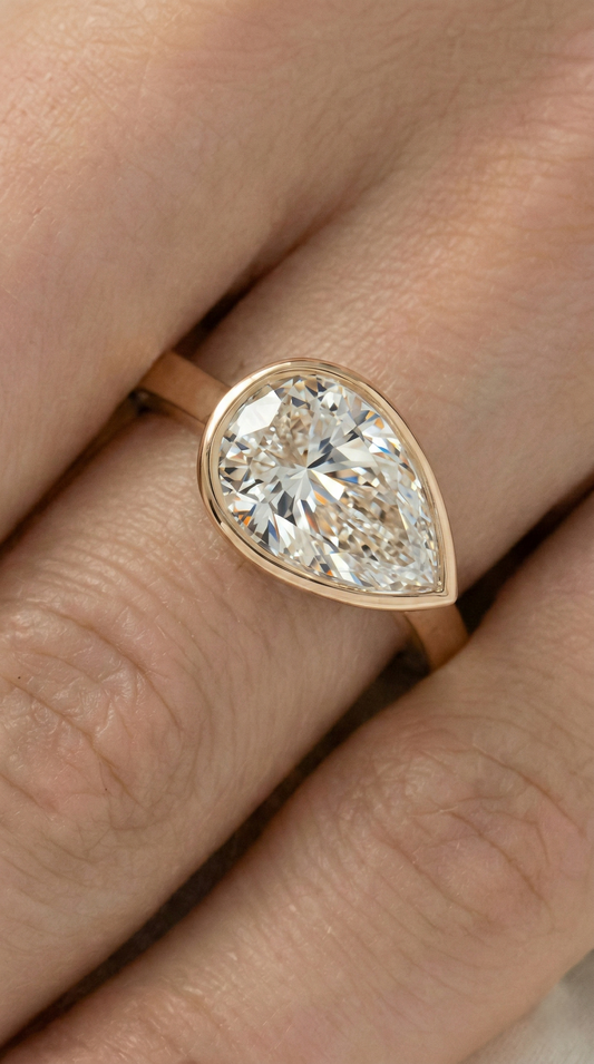 East West Bezel Pear Solitaire Diamond Engagement Ring