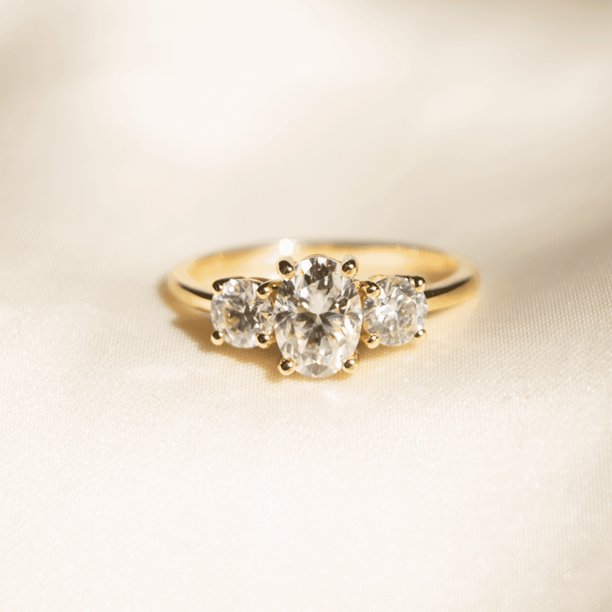 Iris - Oval Trilogy Round Setting Diamond Engagement Ring - Moissanite Engagement Rings