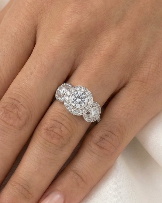Round Trilogy Bezel Half Pavé Moissanite Engagement Ring