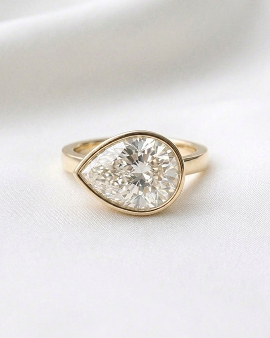 Charlie: East West Bezel Pear Solitaire Moissanite Engagement Ring