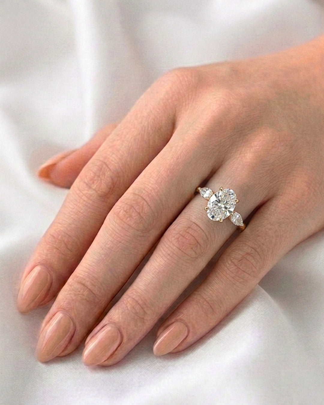 Daisy: Oval and Marquise Three-Stone Moissanite Engagement Ring