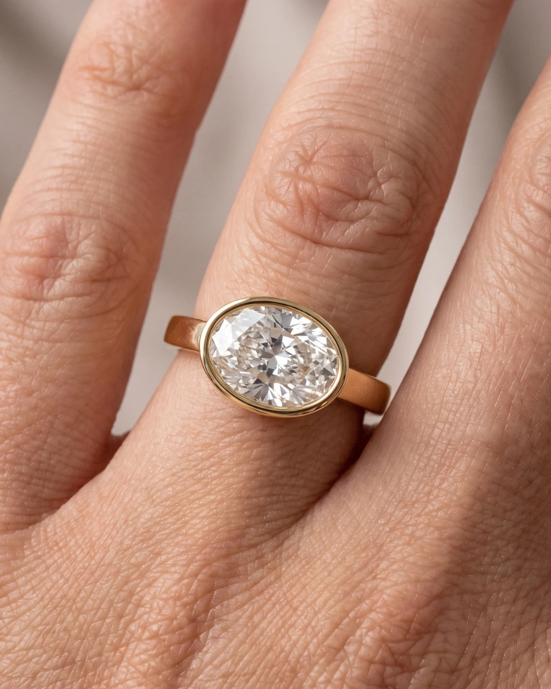 Hattie - East West Bezel Oval Solitaire Moissanite Engagement Ring