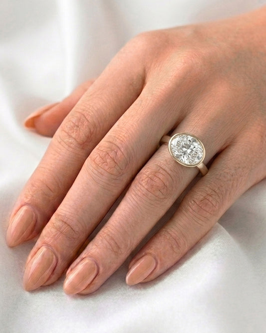 Hattie: East West Bezel Oval Solitaire Moissanite Engagement Ring