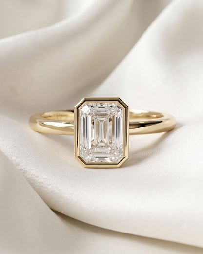 Hilda: Emerald Bezel Solitaire Moissanite Engagement Ring