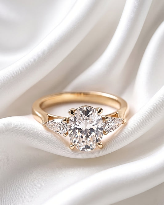 Indigo: Oval Pear Accent Stones Moissanite Engagement Ring
