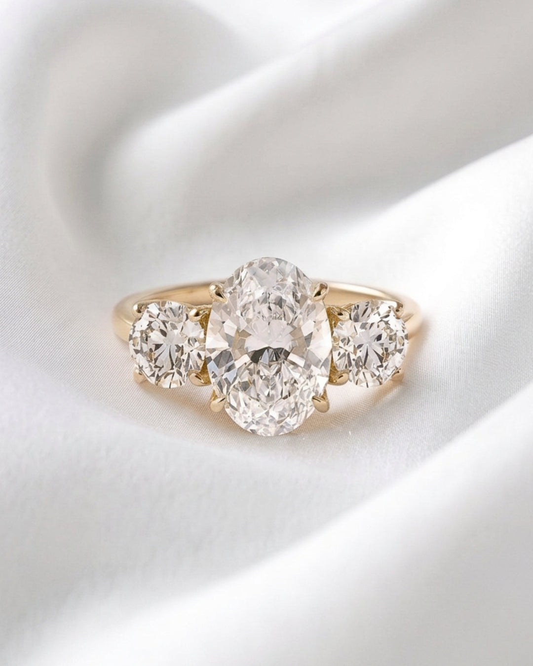 Iris - Oval Trilogy Round Setting Moissanite Engagement Ring