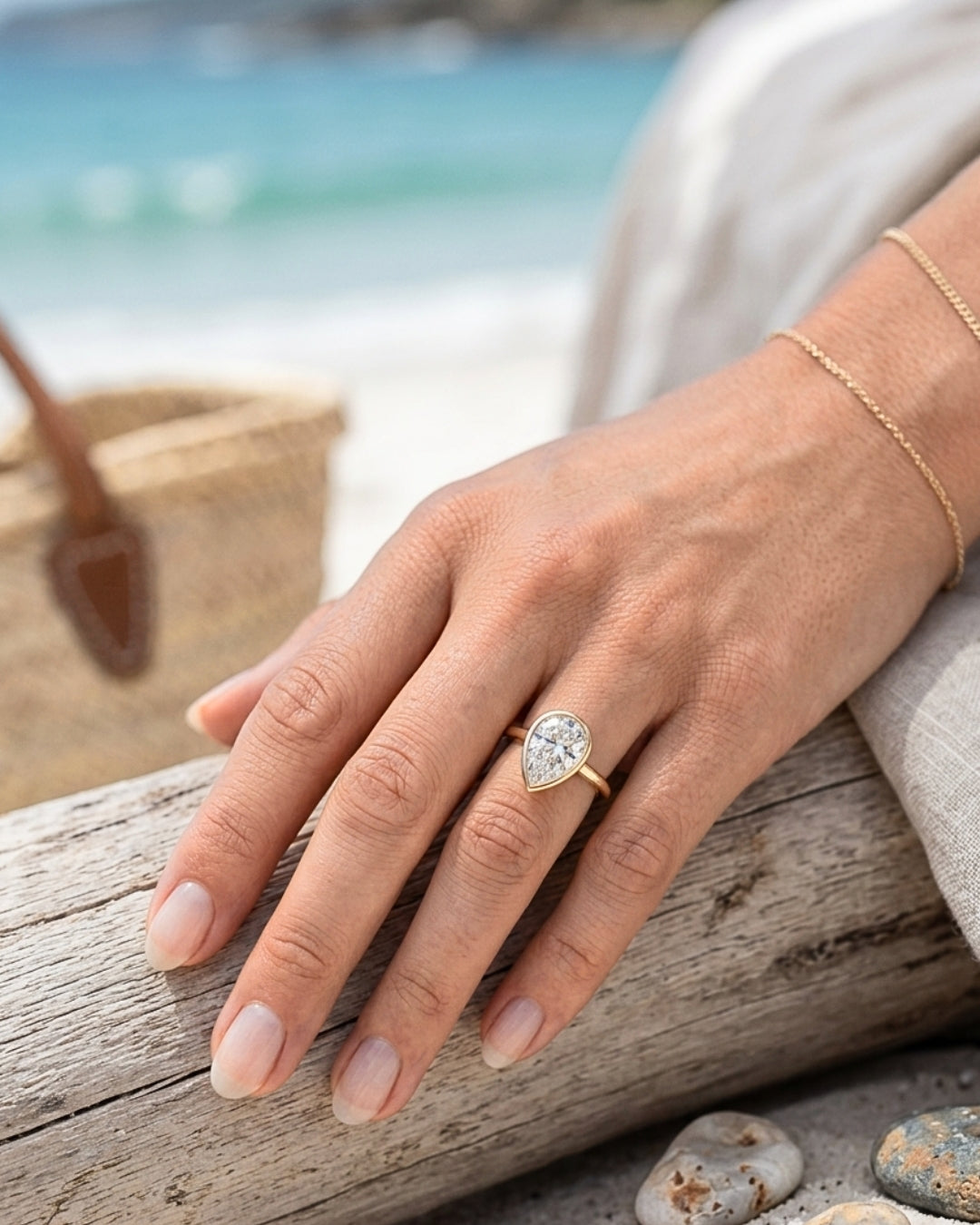 Mae: Pear Bezel Moissanite Engagement Ring