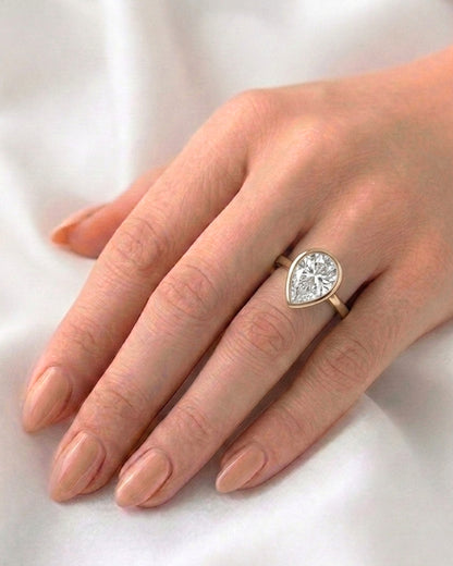 Mae: Pear Bezel Moissanite Engagement Ring
