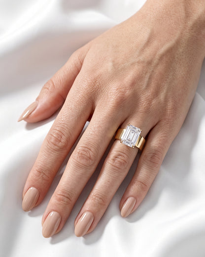 Maude: Emerald Solitaire Cigar Band Moissanite Engagement Ring