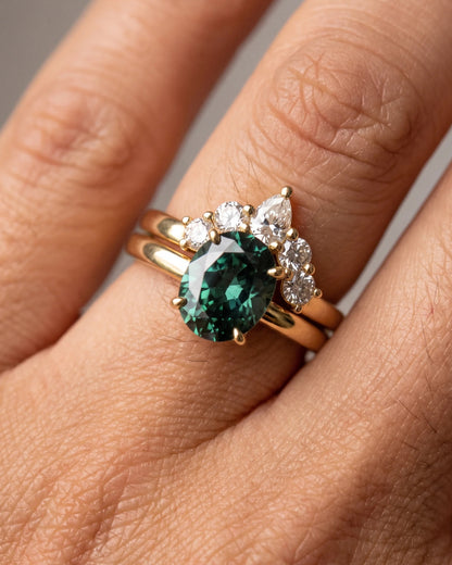 Oval Green Solitaire with Curved Cluster Wedding Band