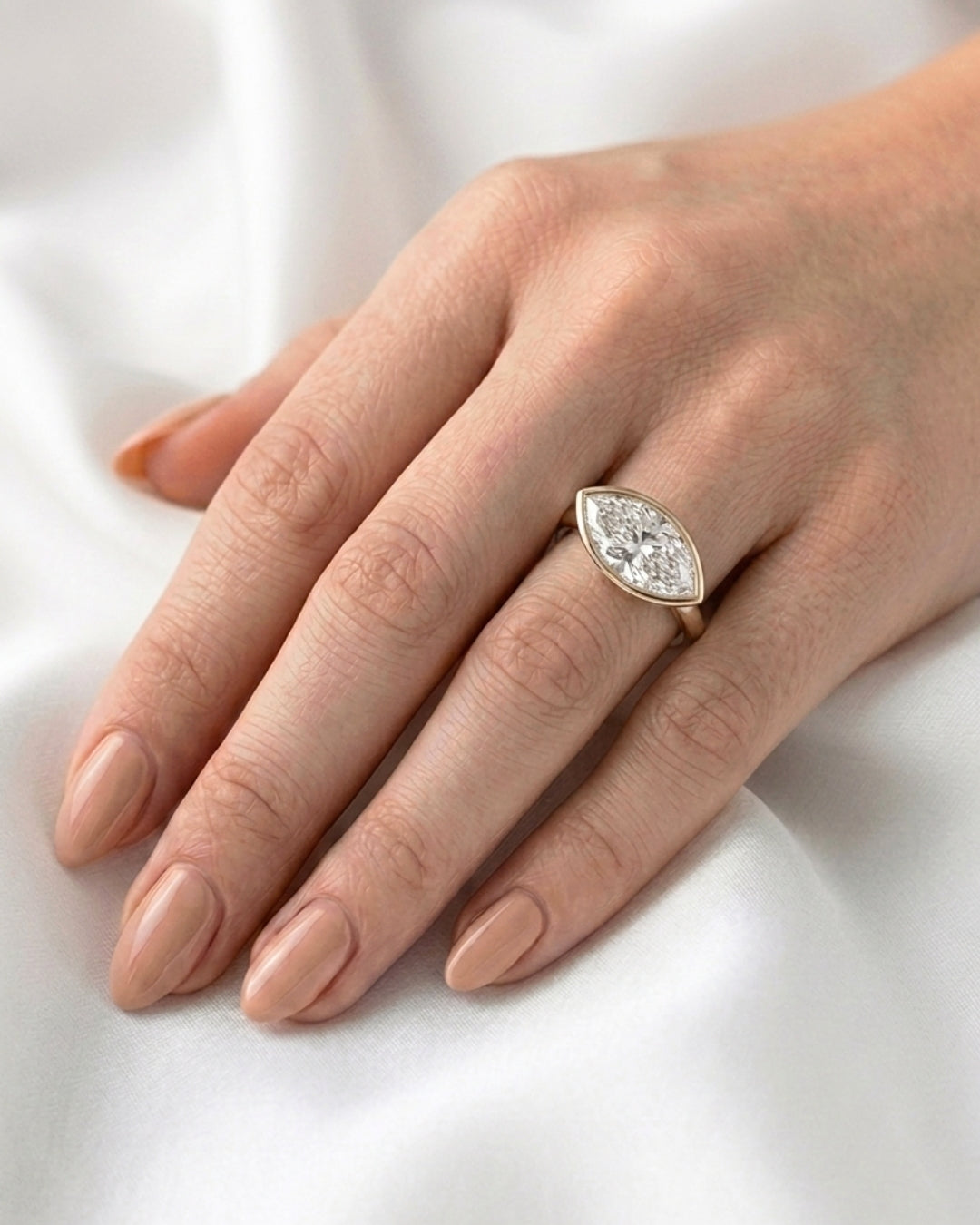 Pearl: East West Bezel Marquise Solitaire Diamond Engagement Ring