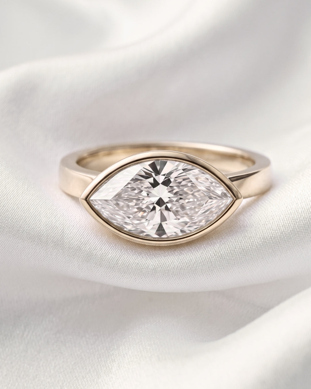 Pearl: East West Bezel Marquise Solitaire Diamond Engagement Ring