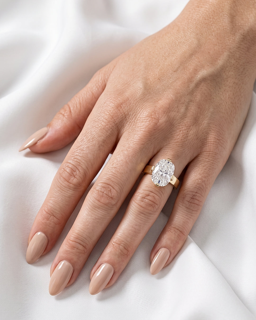 Pippa: Oval Solitaire Compass Prong Moissanite Engagement Ring