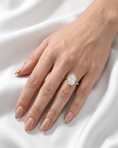 Sabine: Oval Wave Bypass Solitaire Moissanite Engagement Ring