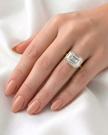 Sadie: East West Bezel Emerald Solitaire Moissanite Engagement Ring