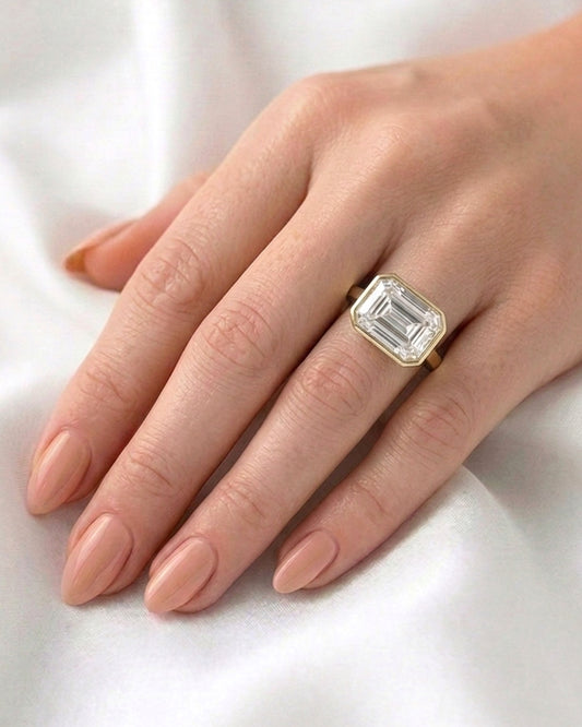 Sadie: East West Bezel Emerald Solitaire Moissanite Engagement Ring