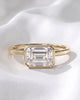 Sadie: East West Bezel Emerald Solitaire Moissanite Engagement Ring