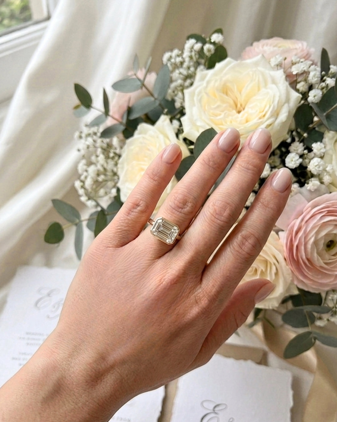 Sadie: East West Bezel Emerald Solitaire Moissanite Engagement Ring