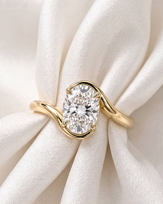 Saskia: Oval Solitaire Curved Band Moissanite Engagement Ring