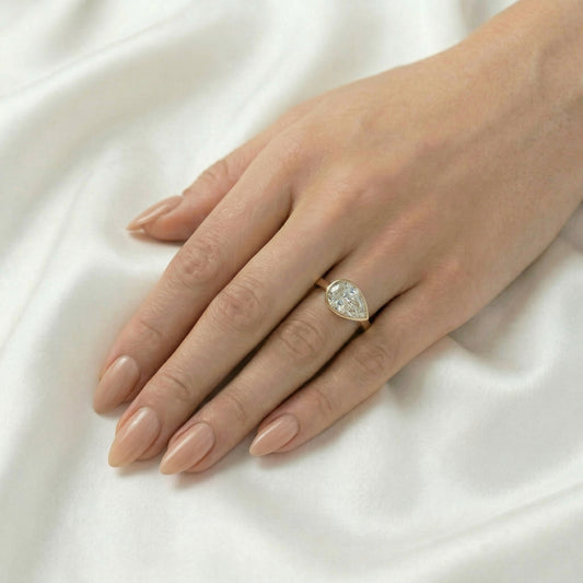 East West Bezel Pear Solitaire Diamond Engagement Ring