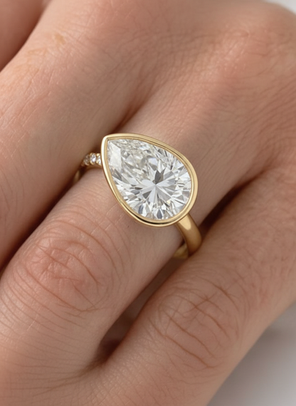 Charlie: East West Bezel Pear Solitaire Moissanite Engagement Ring