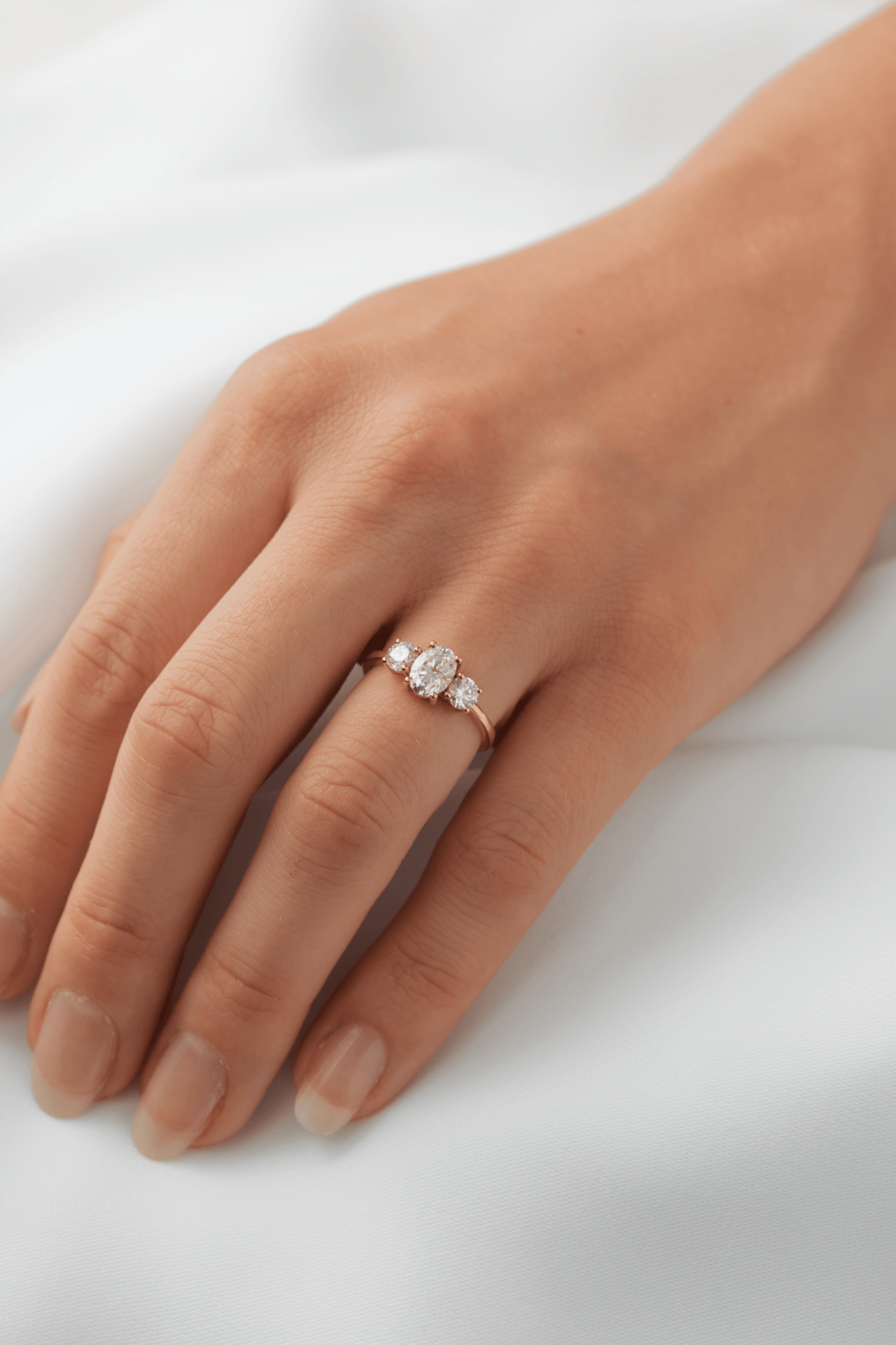 Oval Trilogy Round Setting Diamond Engagement Ring - Moissanite Engagement Rings