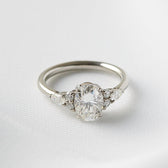 Juniper: Oval Trio Accent Stones Moissanite Engagement Ring