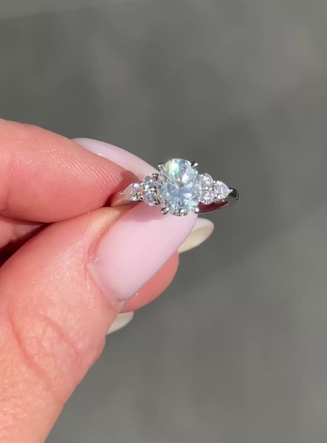 Oval Trio Accent Stones Moissanite Engagement Ring video — front view