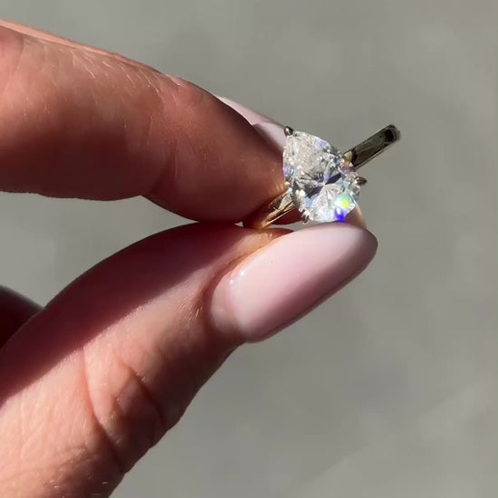 Pear Solitaire Moissanite Engagement Ring video — on hand