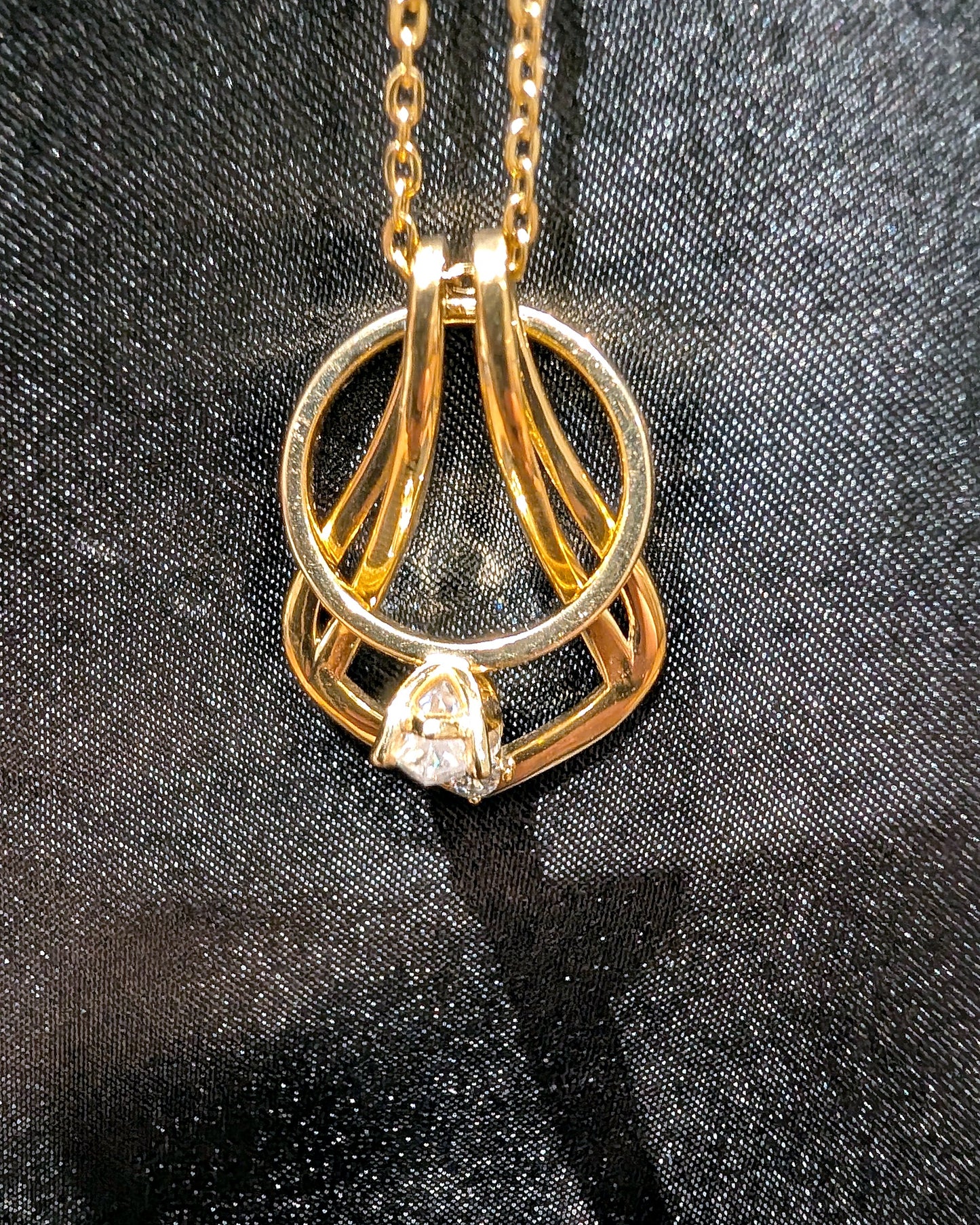 Ring Holder Necklace in gold finish holding a solitaire engagement ring