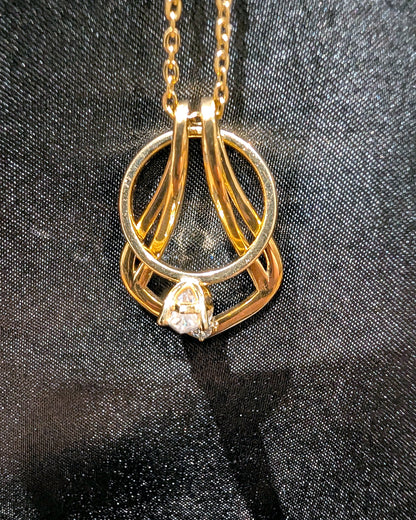 Ring Holder Necklace in gold finish holding a solitaire engagement ring
