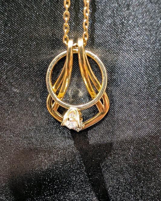 Ring Holder Necklace in gold finish holding a solitaire engagement ring