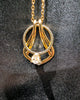 Ring Holder Necklace in gold finish holding a solitaire engagement ring