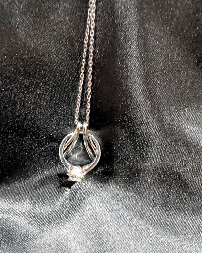 Ring Holder Necklace in silver finish holding an engagement ring