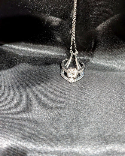 Silver Ring Holder Necklace holding a halo engagement ring